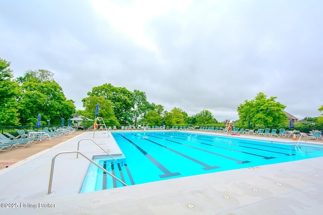 13811 Forest Bend Cir, Louisville, KY 40245 - community pool featuring a patio area and view of wooded area