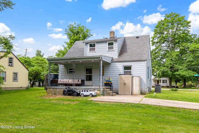 523 Fenley Ave, Louisville, KY 40222 - rear view of property featuring a yard, a patio, a chimney, and roof with shingles