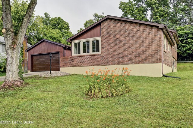 9313 Plumwood Pl, Crestwood, KY 40014 - view of property exterior featuring a garage, brick siding, and a yard