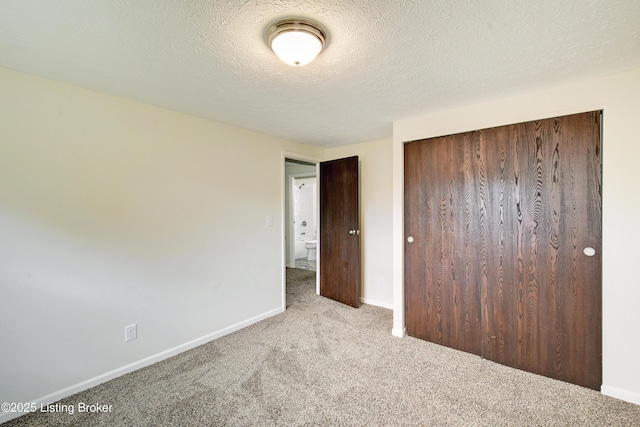 9313 Plumwood Pl, Crestwood, KY 40014 - unfurnished bedroom featuring carpet floors, a closet, and a textured ceiling