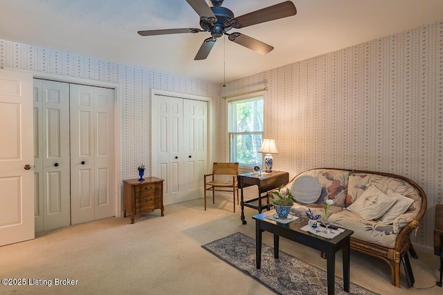 1824 Knollwood Rd, Louisville, KY 40207 - living area with wallpapered walls, carpet floors, and ceiling fan