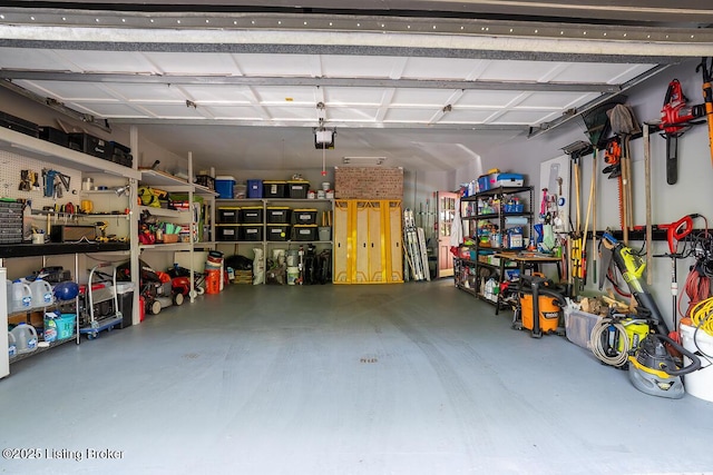 1824 Knollwood Rd, Louisville, KY 40207 - garage featuring a garage door opener and a workshop area