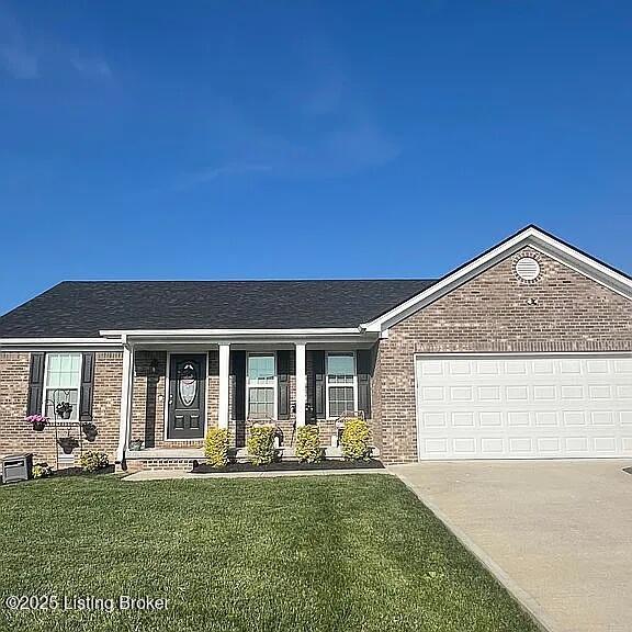 192 Patrum Sisters Way, Danville, KY 40422 - ranch-style home with brick siding, driveway, a front yard, and a garage