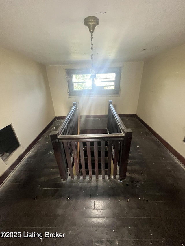 322 N 32nd St, Louisville, KY 40212 - staircase featuring baseboards and wood-type flooring