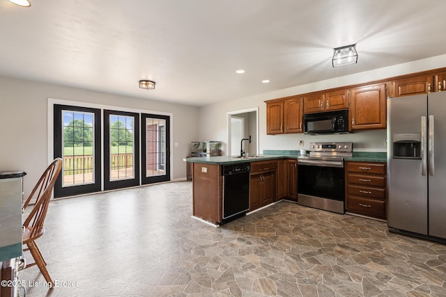9071 Charleston Way, Shelbyville, KY 40065 - kitchen featuring black appliances, dark stone finish floors, a peninsula, dark countertops, and recessed lighting