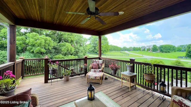 3221 Overlook Ridge Rd, Prospect, KY 40059 - deck featuring a ceiling fan, a lawn, and view of wooded area