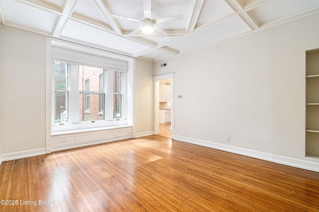 1629 S 3rd St Apt 102, Louisville, KY 40208 - spare room featuring coffered ceiling, light wood-style flooring, beamed ceiling, and ceiling fan