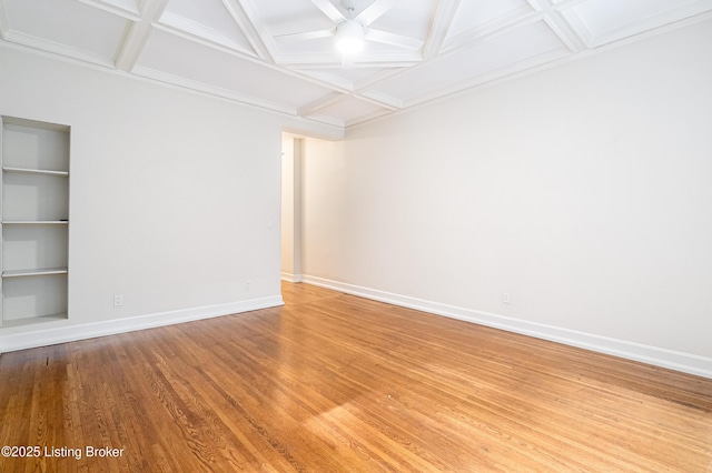 1629 S 3rd St Apt 102, Louisville, KY 40208 - spare room featuring coffered ceiling, light wood-style floors, beam ceiling, and built in features
