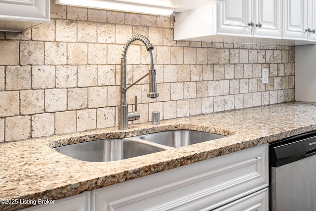 1629 S 3rd St Apt 102, Louisville, KY 40208 - kitchen featuring dishwasher, white cabinetry, and light stone counters