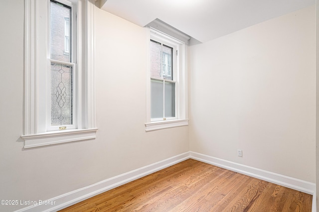 1629 S 3rd St Apt 102, Louisville, KY 40208 - empty room featuring baseboards and light wood finished floors