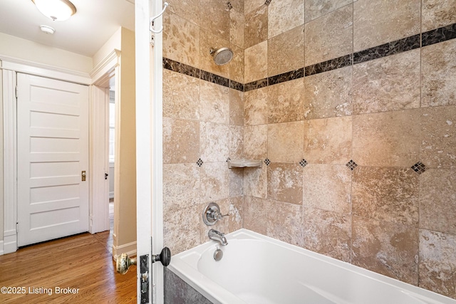 1629 S 3rd St Apt 102, Louisville, KY 40208 - full bath featuring tub / shower combination and wood finished floors