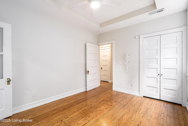 1629 S 3rd St Apt 102, Louisville, KY 40208 - unfurnished bedroom featuring light wood-style flooring, a closet, and ceiling fan