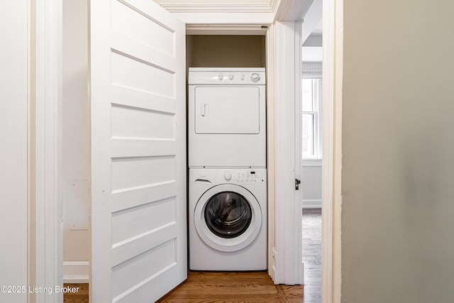 1629 S 3rd St Apt 102, Louisville, KY 40208 - laundry room featuring stacked washer / drying machine and wood finished floors