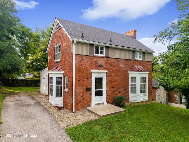 5329 Alpine Way, Louisville, KY 40214 - rear view of property featuring a chimney, brick siding, and a shingled roof