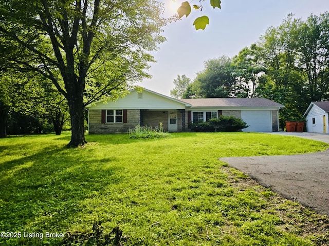 5019 S Wilson Rd, Elizabethtown, KY 42701 - ranch-style house with asphalt driveway, a garage, stone siding, and a front lawn