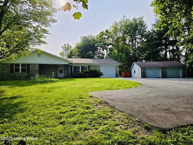 5019 S Wilson Rd, Elizabethtown, KY 42701 - ranch-style house with a detached garage, a front lawn, and an outbuilding