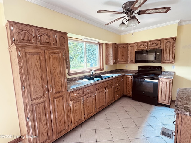 5019 S Wilson Rd, Elizabethtown, KY 42701 - kitchen with black appliances, light tile patterned floors, crown molding, brown cabinets, and a ceiling fan