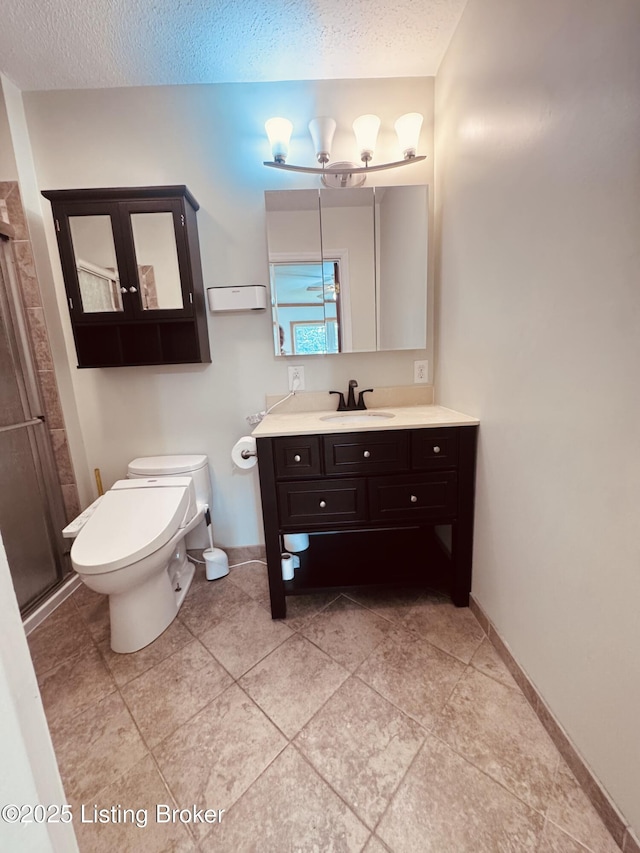 5019 S Wilson Rd, Elizabethtown, KY 42701 - bathroom featuring vanity, a textured ceiling, and a stall shower