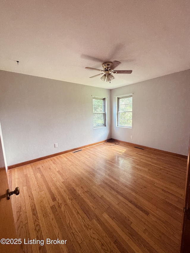 5019 S Wilson Rd, Elizabethtown, KY 42701 - empty room with light wood-style flooring and a ceiling fan
