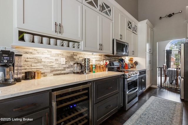 3506 Coventry Tee Ct, Louisville, KY 40241 - kitchen with beverage cooler, stainless steel appliances, white cabinets, glass insert cabinets, and light stone counters