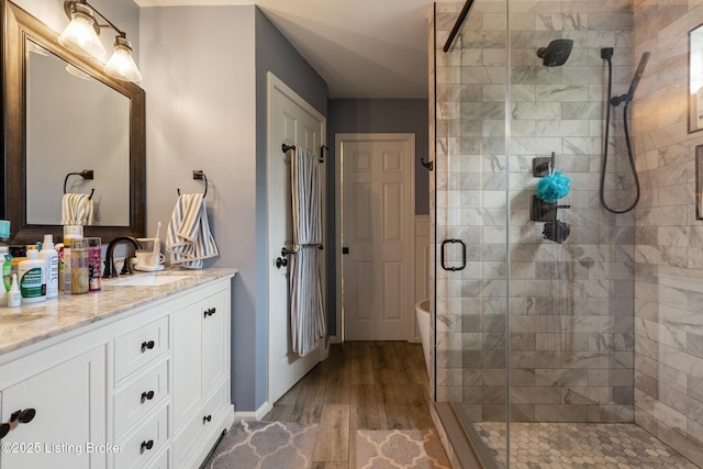 3506 Coventry Tee Ct, Louisville, KY 40241 - bathroom featuring a stall shower, vanity, wood finished floors, and a freestanding bath