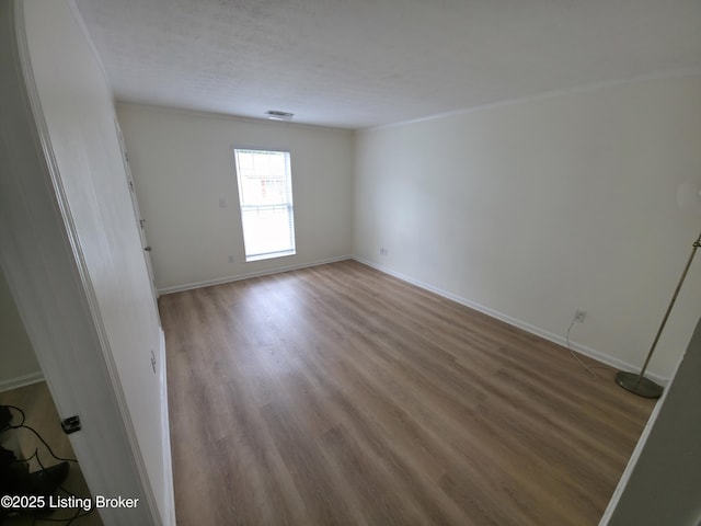 8308 Lake Superior Dr, Louisville, KY 40291 - spare room with wood finished floors and baseboards