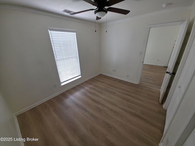 8308 Lake Superior Dr, Louisville, KY 40291 - empty room with a ceiling fan, a smoke detector, wood finished floors, and crown molding