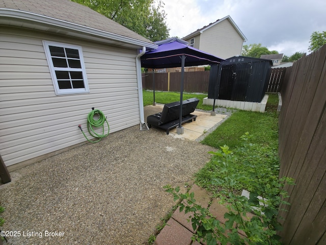 8308 Lake Superior Dr, Louisville, KY 40291 - fenced backyard with a gazebo, a shed, and a patio