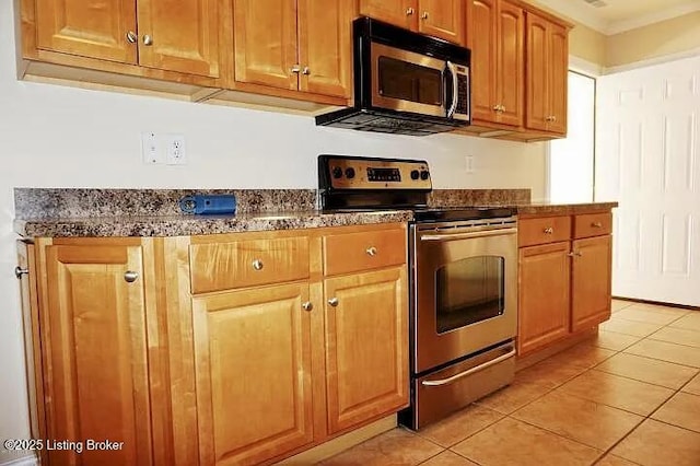 7816 Turtle Run Ct #, Ct-F Prospect, KY 40059 - kitchen with appliances with stainless steel finishes, light tile patterned flooring, brown cabinets, and ornamental molding