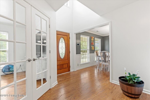 9311 Artis Way, Louisville, KY 40291 - entrance foyer featuring french doors, wood finished floors, healthy amount of natural light, and ornamental molding