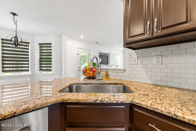 9311 Artis Way, Louisville, KY 40291 - kitchen with tasteful backsplash, dark brown cabinets, stainless steel dishwasher, light stone counters, and recessed lighting