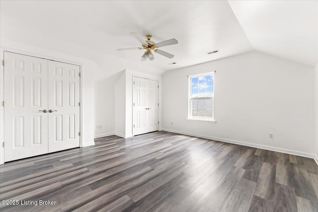 9311 Artis Way, Louisville, KY 40291 - unfurnished bedroom with multiple closets, lofted ceiling, dark wood-style flooring, and ceiling fan