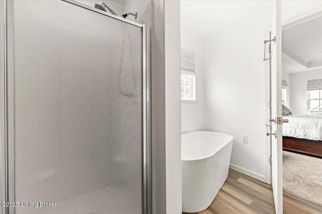 9311 Artis Way, Louisville, KY 40291 - bathroom featuring ensuite bathroom, a shower stall, wood finished floors, and a freestanding tub