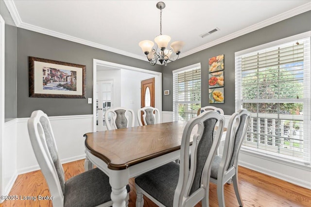 9311 Artis Way, Louisville, KY 40291 - dining space featuring a chandelier, crown molding, and light wood-style flooring