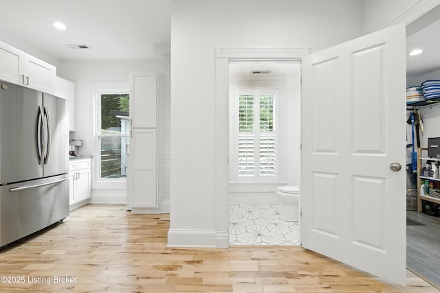 143 State St, Louisville, KY 40206 - kitchen featuring freestanding refrigerator, white cabinetry, plenty of natural light, light wood-style flooring, and recessed lighting