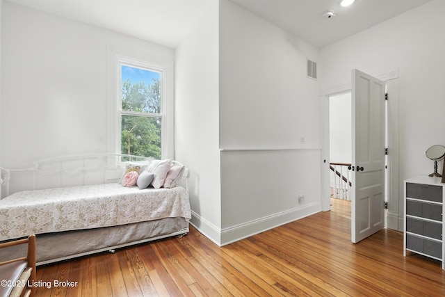 143 State St, Louisville, KY 40206 - bedroom featuring wood-type flooring and baseboards