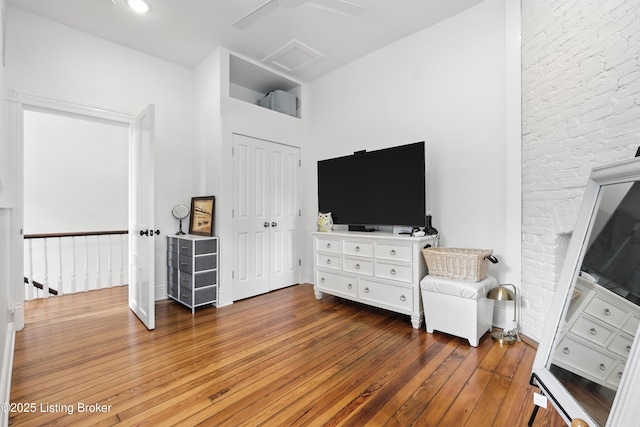 143 State St, Louisville, KY 40206 - living area with hardwood / wood-style flooring, attic access, and a high ceiling