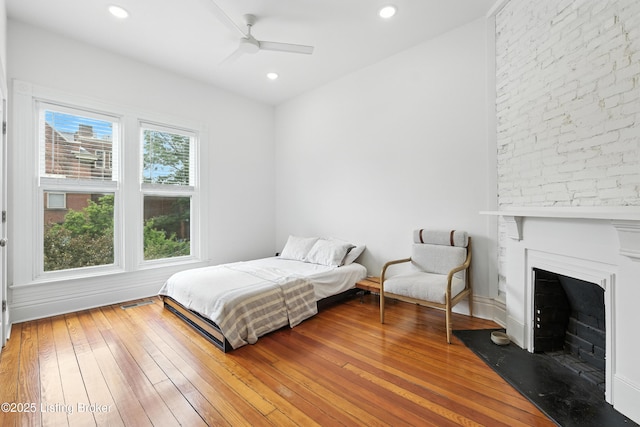143 State St, Louisville, KY 40206 - bedroom with hardwood / wood-style floors, a fireplace, recessed lighting, and ceiling fan