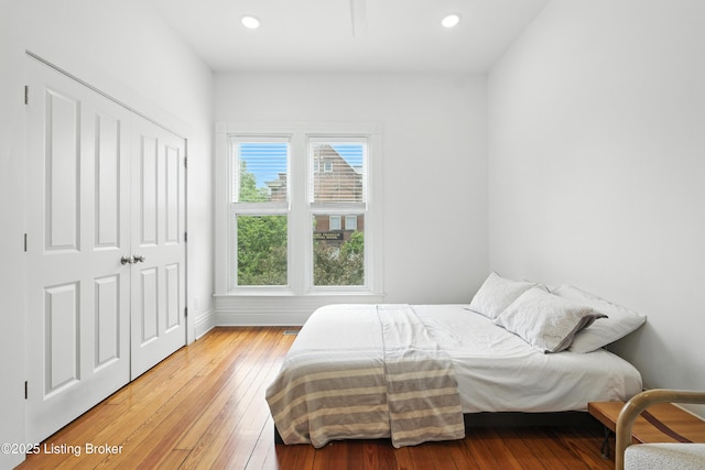 143 State St, Louisville, KY 40206 - bedroom with light wood-style flooring, recessed lighting, and a closet