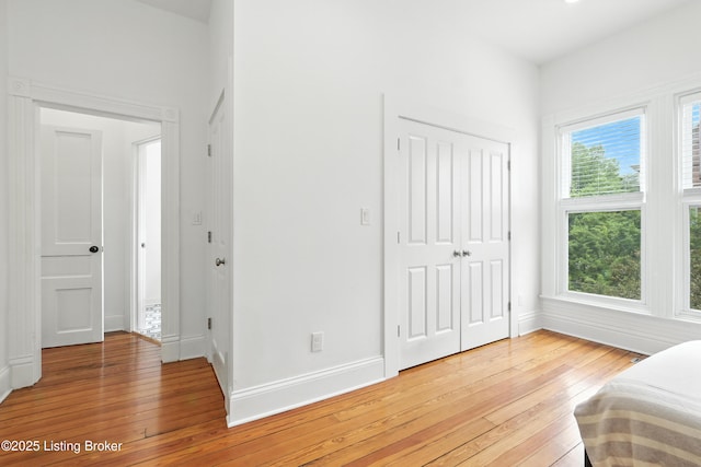 143 State St, Louisville, KY 40206 - bedroom with light wood finished floors and a closet