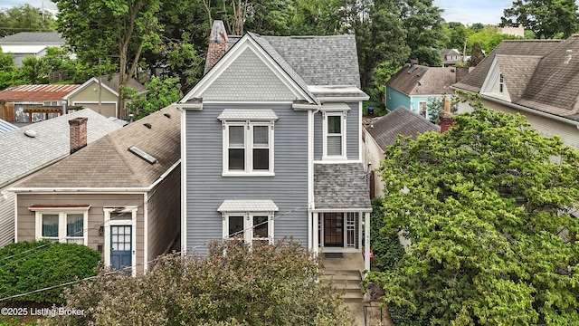 143 State St, Louisville, KY 40206 - view of front of home with a chimney and a shingled roof