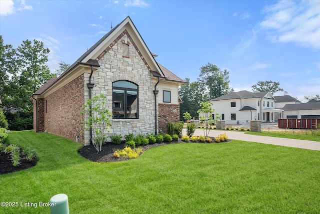 6511 Rosecliff Ct, Prospect, KY 40059 - view of front of home featuring stone siding, a front yard, and brick siding
