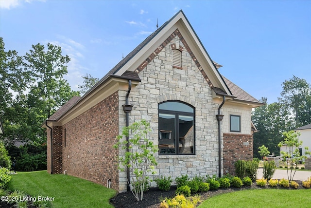 6511 Rosecliff Ct, Prospect, KY 40059 - view of side of home featuring stone siding, a yard, and brick siding