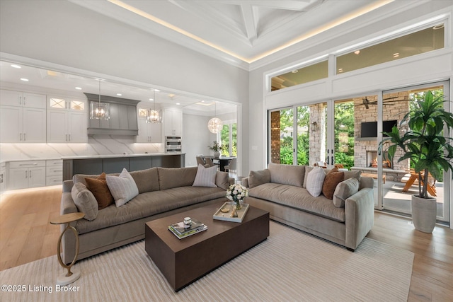 6511 Rosecliff Ct, Prospect, KY 40059 - living area featuring a chandelier, light wood finished floors, crown molding, recessed lighting, and a fireplace