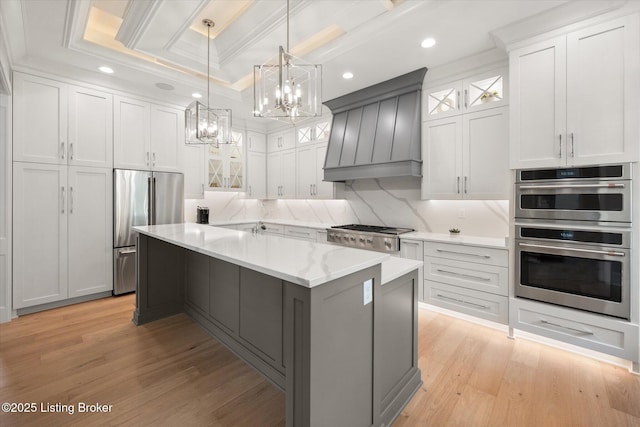 6511 Rosecliff Ct, Prospect, KY 40059 - kitchen featuring stainless steel appliances, a chandelier, light wood-type flooring, glass insert cabinets, and recessed lighting