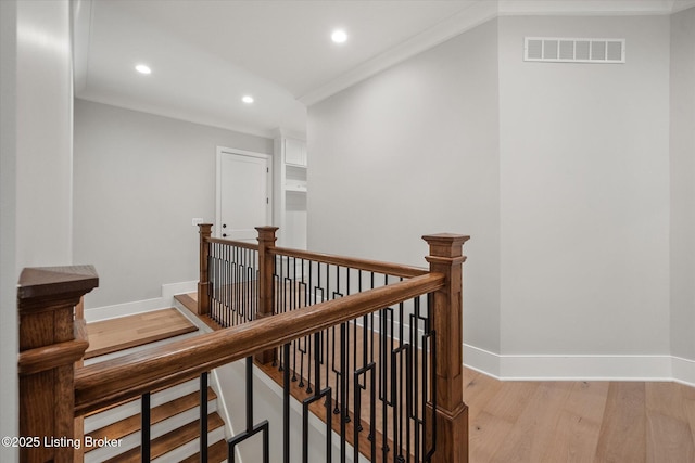 6511 Rosecliff Ct, Prospect, KY 40059 - hallway with an upstairs landing, recessed lighting, wood finished floors, and crown molding