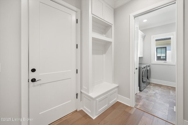 6511 Rosecliff Ct, Prospect, KY 40059 - mudroom featuring independent washer and dryer, light wood-type flooring, and crown molding