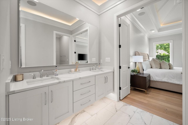 6511 Rosecliff Ct, Prospect, KY 40059 - bathroom with ornamental molding, double vanity, a tray ceiling, marble look tile flooring, and ensuite bath
