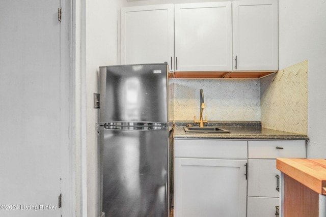 1131 S Brook St Apt 3, Louisville, KY 40203 - kitchen featuring freestanding refrigerator, white cabinets, and tasteful backsplash
