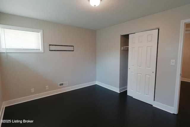 10104 Nanka Rd, Louisville, KY 40272 - unfurnished bedroom with a closet and dark wood-style floors